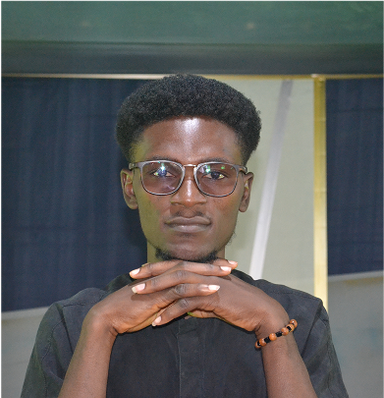 Benjamin Shalom, Accessible UI/UX Designer at ZATS, with glasses and hands together in front of face.